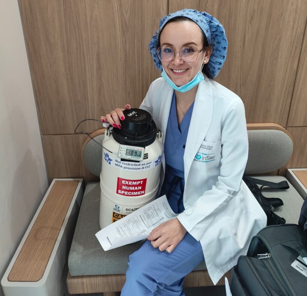 A Mondo IVF courier personally delivering a cryogenic dry shipper to a fertility clinic professional, ensuring continuous chain of custody.